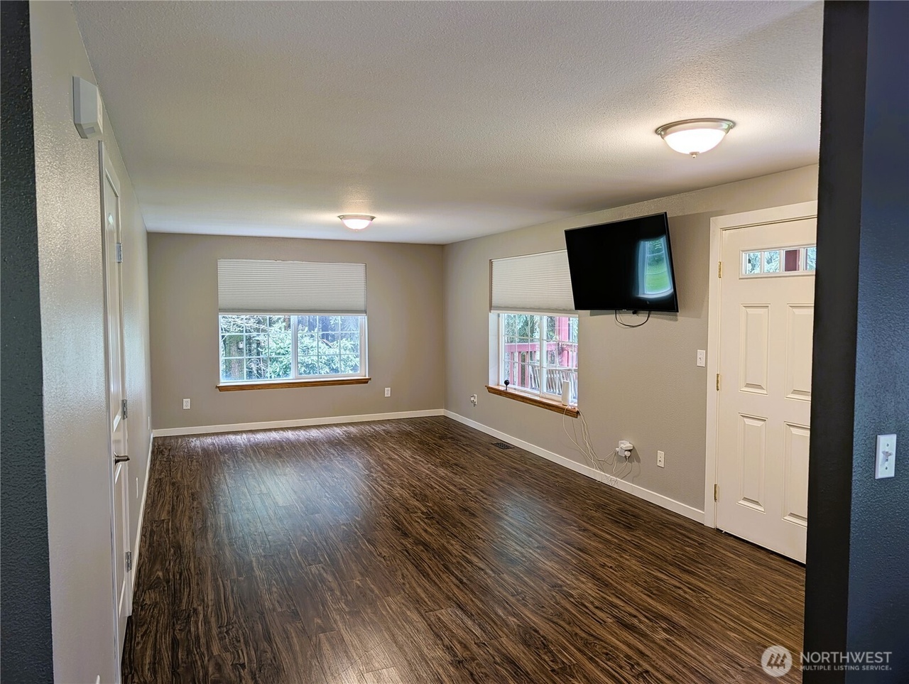 Downstairs living room with hardwood floors